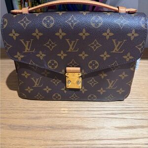 Louis Vuitton Brown Monogram Clutch with Gold Accents